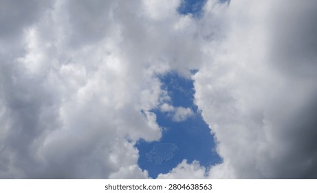 A Glimpse of Blue Behind the Clouds