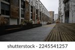Glimpse of the Larson Walk alley in london with benches and houses
