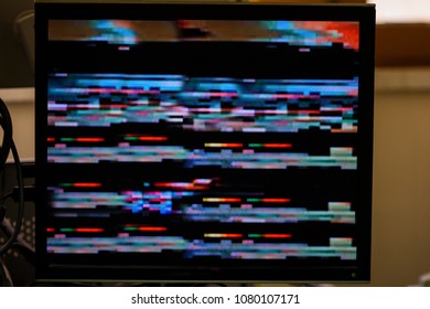 Glitch on the computer screen when checking electronic devices at a high-tech plant. Real candid image.