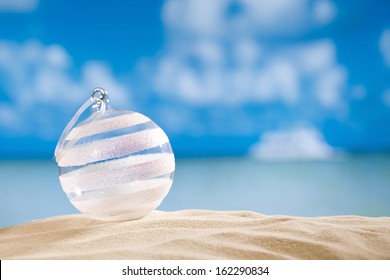 Glitter Christmas Glass Ball On  Beach With Seascape Background