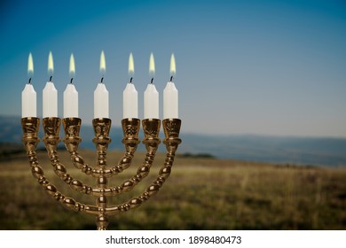 Glitter Lights Of Candles On Menorah Are Traditional Symbols For Jewish Hanukkah Holiday Of Light.