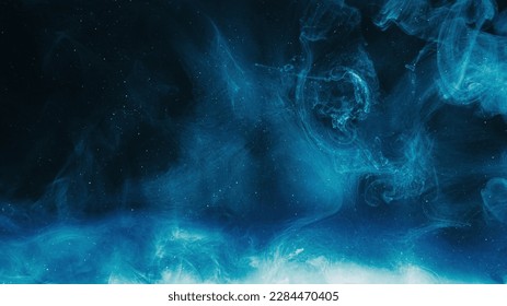 Glitter mist. Color cloud. Night sky. Blue shiny sparkling particles smoke floating on dark black abstract art background with copy space. - Powered by Shutterstock