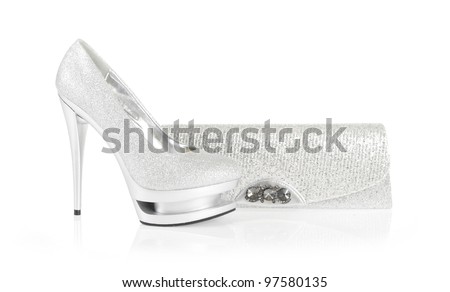 silver heels and clutch bag