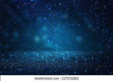 glitter vintage lights background. black and blue. de-focused