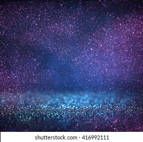 Glitter Vintage Lights Background. Blue, Silver, Purple And Black. Defocused.
