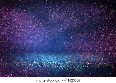 Glitter Vintage Lights Background. Blue, Purple And Black. Defocused.