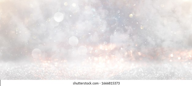 glitter vintage lights background. gold, silver and white. de-focused - Shutterstock ID 1666815373