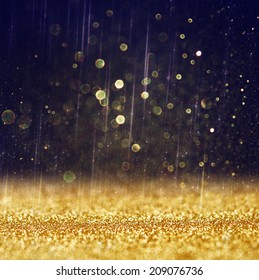 Glitter Vintage Lights Background. Gold And Black. Defocused. 