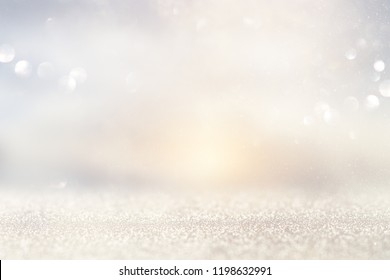 glitter vintage lights background. silver and light gold de-focused