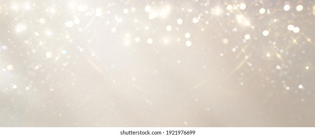 glitter vintage lights background. silver, gold and white. de-focused - Powered by Shutterstock