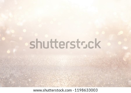 glitter vintage lights background. silver and light gold de-focused