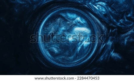 Glitter whirl. Fluid circle. Ink water. Astrology horoscope. Blue color glowing sparkling smoke cloud round frame on dark black abstract background.