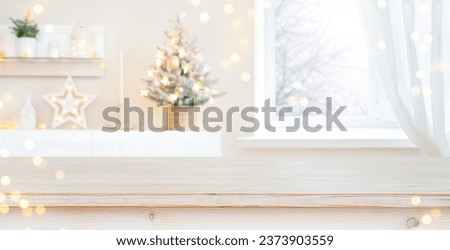Glittering Christmas holiday background with empty wooden table in front