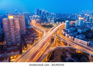 a glittering city highway intersection in shanghai at twilight - Shutterstock ID 201392192