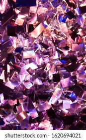 Glittering Purple And Blue Confetti On Juicy Red Trendy Background. Festive Background For Projects.