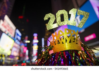 Glittery 2017 Happy New Year Message With Celebration Tinsel Flying On Novelty Party Hat In Times Square, New York City