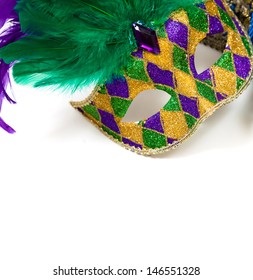 A Glittery Mardi Gras Mask On A White Background With Copyspace