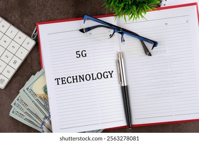 Global business, finances, computing and data processing concept. 5G TECHNOLOGY It is written in a business book in a composition with a calculator, a pen and dollar bills.