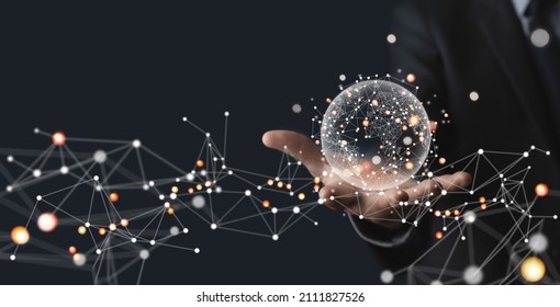 Global business, internet network connection, IoT Internet of Things, business intelligence concept. Businessman hand holding global network, futuristic technology background - Powered by Shutterstock