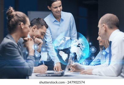 Global Business, Technology, Management , Connection And People Concept - Smiling Female Boss Talking To Business Team In Office