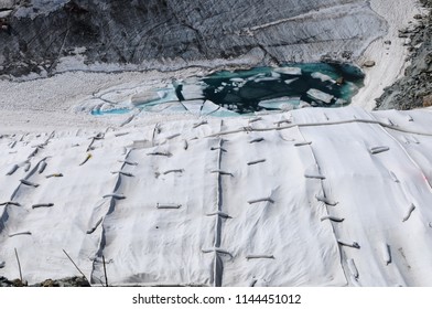 Global clima change: The Corvatsch-Glacier near St. Moritz covered in summertime with huge blankets