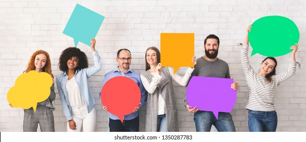 Global Communications. Group Of Happy Young Diverse People Holding Empty Colorful Speech Bubbles And Smiling At Camera