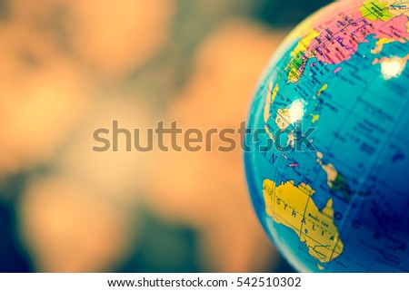Global concept.  Blue Globe Against Blurred World Map.