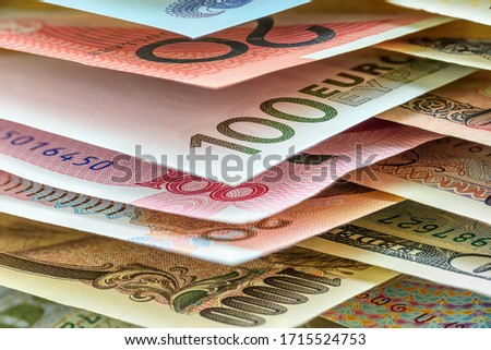 Global currency / forex, foreign money exchange concept : Paper banknotes from around the world e.g AUD 20 Australian dollar, EUR 100 euro, CNY 100 Chinese yuan, JPY 10000 Japanese yen, US 100 dollar