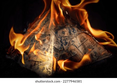 A global financial pyramid based on the dominance of the dollar. World management concept. conspiracy theory. the collapse of the dollar's financial system. Money is burning on a dark background.
