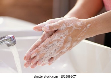 Global Handwashing Day Concept/Washing of hands with soap in bathroom.  - Powered by Shutterstock