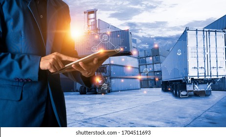 Global logistic or world of logistic concept. Businessman or manager using tablet standing with world map icon and shipping yard container and truck of transport background. fast or instant shipping. - Powered by Shutterstock