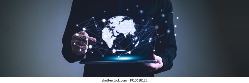 Global network communication connection concept, Man holding digital tablet and pointing finger to graphic hitech earth - Shutterstock ID 1913618125
