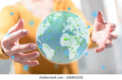 Global network concept between hands of a woman in background