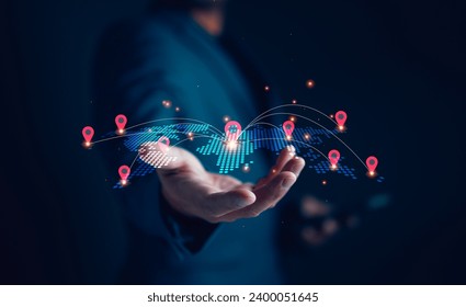Global network concept, Businessman holding virtual world map with location icon and connection line for business technology smart data, worldwide, connect, community.