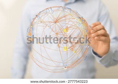 Global network sphere held by a person showing connections