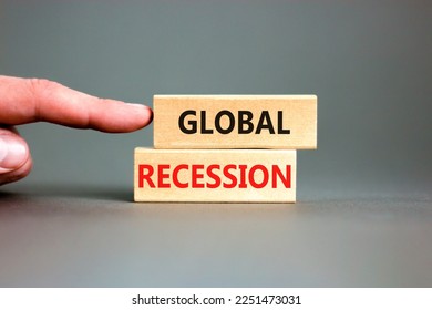 Global recession symbol. Concept words Global recession on wooden blocks. Beautiful grey table grey background. Businessman hand. Business and global recession concept. Copy space. - Shutterstock ID 2251473031