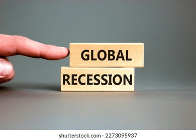 Global recession symbol. Concept words Global recession on wooden blocks. Beautiful grey table grey background. Businessman hand. Business and global recession concept. Copy space. - Shutterstock ID 2273095937