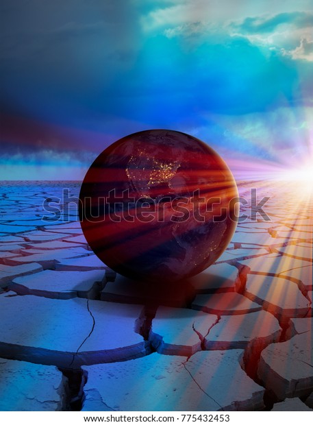Global warming concept - Planet\
Earth on dry soil \