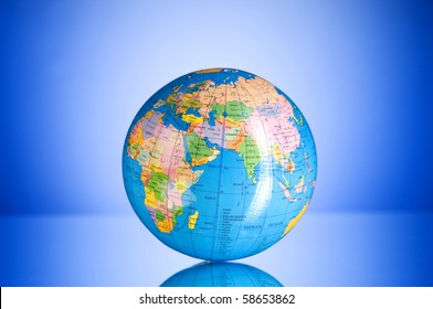 Globalisation concept - globe against gradient colorful background