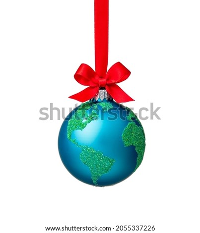 Globe Christmas ornament with red bow isolated on white. Peace on Earth, eco friendly or winter travel concept.