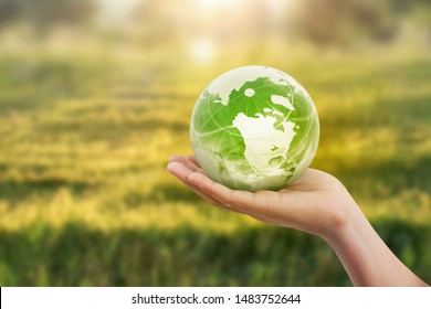 Globe ,earth in human hand,  holding our planet  glowing. Earth image provided by Nasa - Shutterstock ID 1483752644