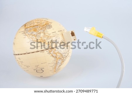 Globe with ethernet cable showing connection to the world