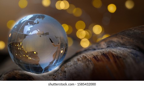 Globe with europe and africa on golden background lights