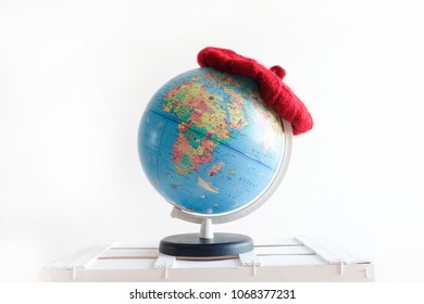 A GLOBE WITH A HAT