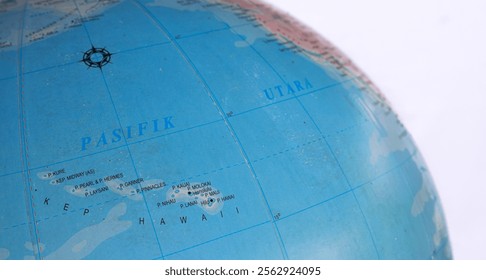 Globe Isolated on white background. Close-up of the globe showing the Hawaiian Islands. Suitable for travel planning and tourism.