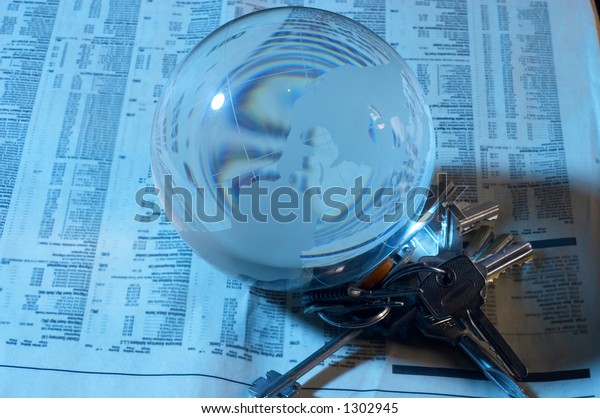 globe made of glass on\
newspapers