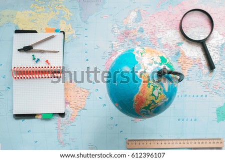 Globe on the background of the world map