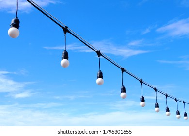 Globe String Light Bulbs With Blue Sky Background.