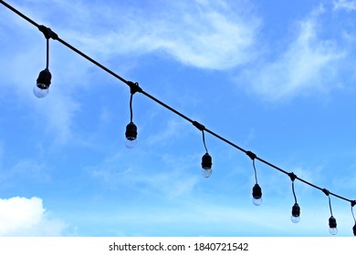 Globe String Light Bulbs With Blue Sky Background.