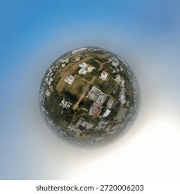 A globe style drone view capturing my location at the heart of the earth with a curved horizon , ultra wide perspective and cinematic aerial realism 